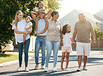 Big family, outdoor and walking in neighbourhood together for fun, bonding or activity with kids, parents and grandparents. Happy, time and outdoor in summer to relax with children on vacation