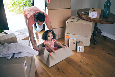 Buy stock photo Dad, child and box in new home for games, fun and freedom on floor of real estate property from above. Happy father, excited family and girl kid play in cardboard boxes for race while moving in house