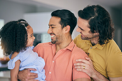 Buy stock photo Gay father, girl and hug in home for smile, comic laugh or together for bonding, care or love. LGBTQ men, parents and happy female child with embrace, funny joke or adoption with talk in family house