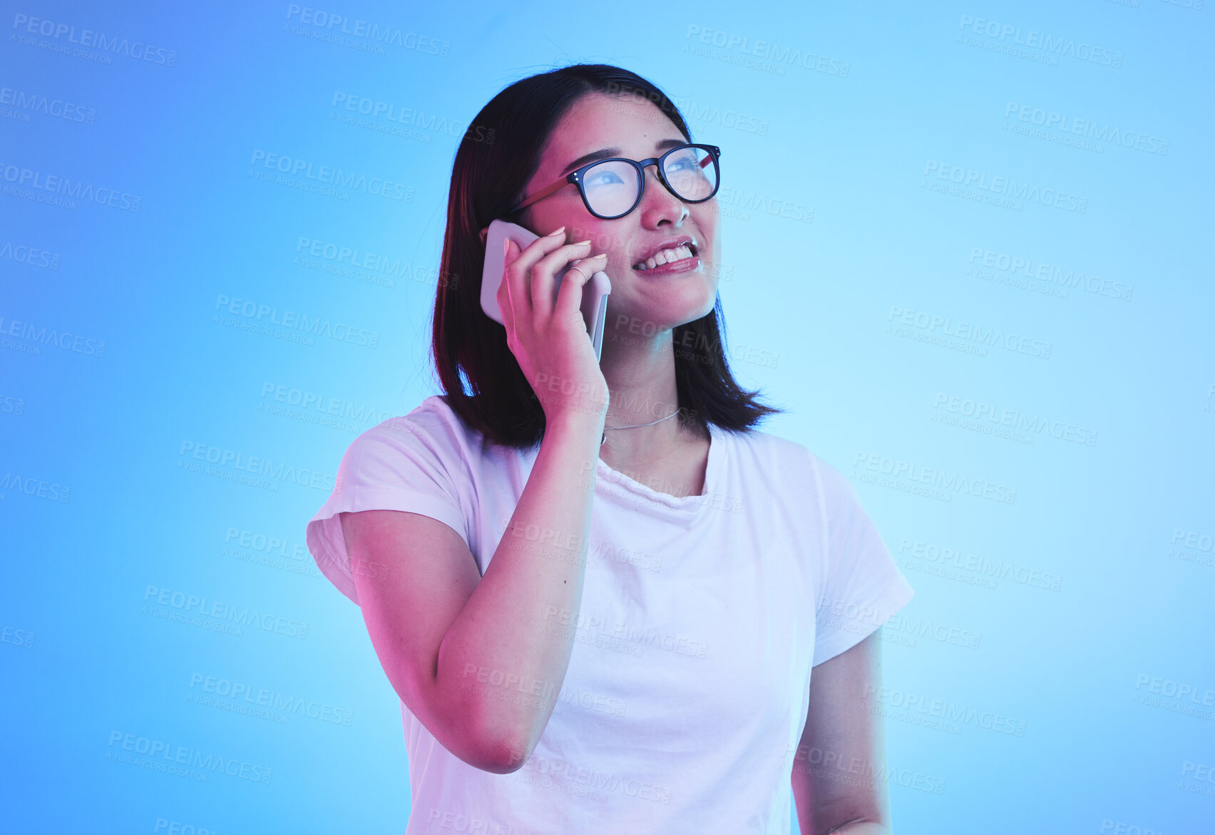 Buy stock photo Phone call, thinking an Asian woman in conversation using mobile app to contact person online for talking or discussion. Connection, cellphone and young female speaking with smile for communication
