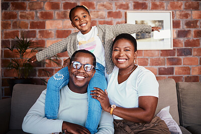 Buy stock photo Portrait of black family in home, parents and kid on sofa with piggy back, bonding and relax in lounge. Mom, dad and girl child on couch in apartment with playful man, woman and daughter together.