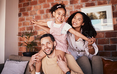 Buy stock photo Family, happy and playing airplane on a home sofa for fun, freedom and time together. Portrait of a man, woman and girl kid in a lounge with love, care or happiness for game in a house in Puerto Rico