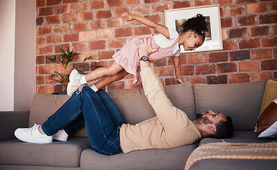 Buy stock photo Sofa, airplane and dad playing child or daughter enjoy game as bonding for care together in a home or house. Fly, love and father with kid in living room, happy and smile on weekend for happiness
