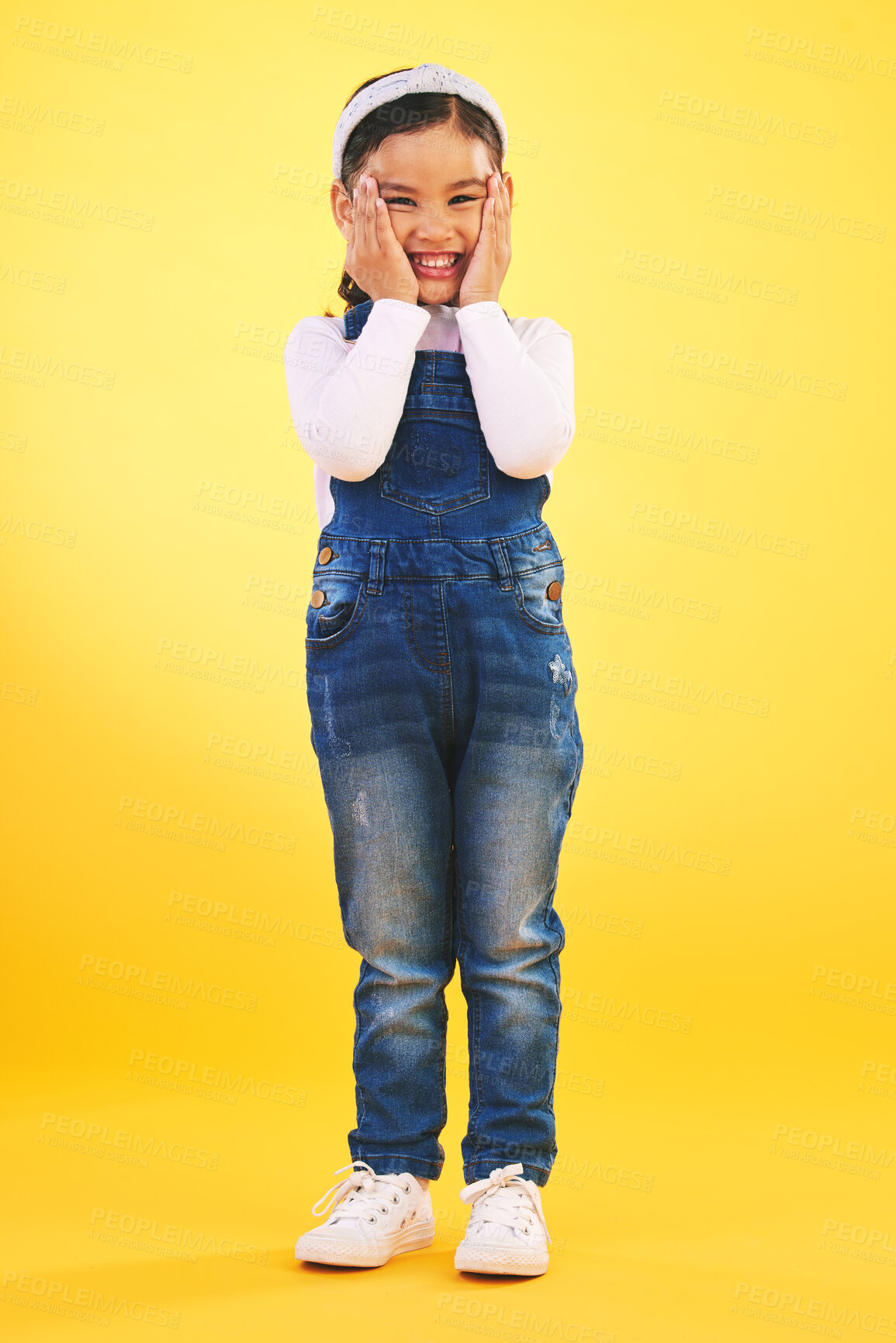 Buy stock photo Fashion, portrait and hands on face of girl child in studio with deal, sale or giveaway on yellow background. Wow, emoji and mind blown kid winner with celebration for coming soon, surprise or prize