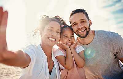 Buy stock photo Family, parents and child in selfie at beach, travel and bonding with sunshine, summer and fun together with memory. Man, woman and girl kid smile in picture, portrait and adventure with vacation