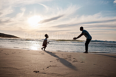 Buy stock photo Child run into father arms, beach and family with games, love and travel, freedom and fun together outdoor. Happy people, freedom and adventure, man and girl bond with tropical holiday and silhouette