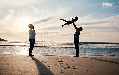 Buy stock photo Family, beach and child in air with parents, sunshine with happiness and together with bonding on vacation. Travel, adventure and mother, father and kid flying, happy people in nature with silhouette