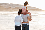 Family, beach and watch sunset and ocean, travel and bonding, love with back view and together outdoor. Vacation, waves and people in nature, man and woman with kid, sunshine and adventure with peace