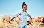 Farm, cows and portrait of girl in countryside for ecology, adventure and agriculture in field. Childhood, sustainable farming and happy kid with open arms for freedom, relax and learning with cattle