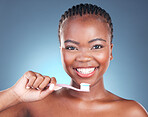 Happy black woman, portrait and toothbrush in teeth cleaning or dental care against a studio background. Face of African female person with big smile in tooth whitening, oral or mouth and gum hygiene