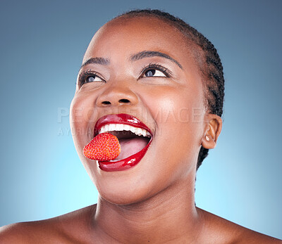 Buy stock photo Skincare, strawberry and black woman with beauty, health and wellness on a blue studio background. Person, fruit and model with cosmetics, diet and nutrition with grooming, aesthetic and dermatology