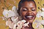 Black woman, flowers and beauty with smile, makeup and natural cosmetics isolated on studio background. African model, orchid and nature, sustainable skincare with eyes closed, facial and glow