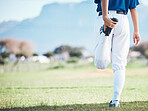 Back, baseball and athlete stretching legs at field outdoor in healthy body exercise. Warm up, hands and person prepare in sports training, wellness workout and fitness to start softball mockup space