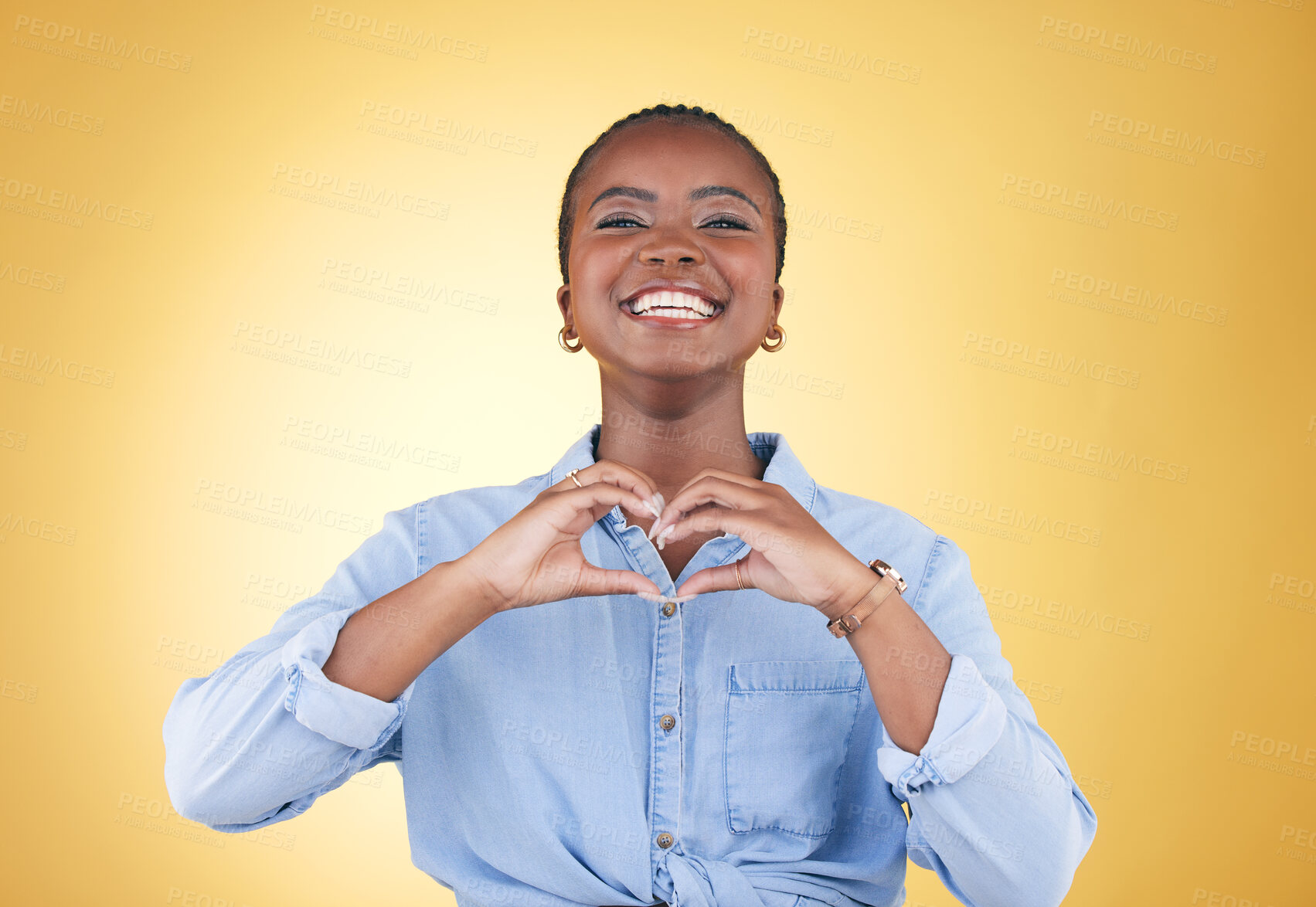 Buy stock photo Portrait, heart hands and black woman, smile and studio isolated on yellow background. Face, love sign and happy African person in kindness, care and empathy, support and trust, romance or solidarity