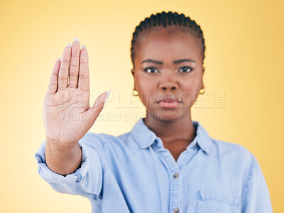 Buy stock photo Black woman, hand and stop, warning and caution in portrait with communication isolated on yellow background. Gesture, emoji and censored, palm and no entry with protest, fight and conflict in studio