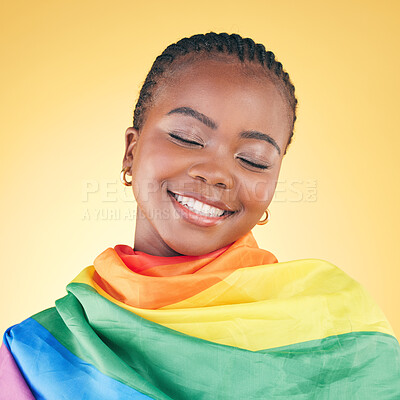 Buy stock photo African woman, lgbt flag and studio with smile, thinking and eyes closed for inclusion by yellow background. Young lesbian woman, rainbow cloth or fabric for vote, equality and happy with gay pride