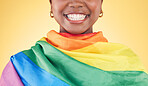 Woman, mouth closeup and rainbow flag in studio for smile, teeth or happy for inclusion by yellow background. Lesbian girl, cloth or fabric for lgbtq equality, pride or excited for sign, icon or vote