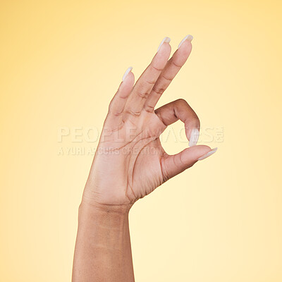 Buy stock photo Perfect, ok and hand sign  in studio with decision, agreement and success of good news. Yellow background, yes vote and accept approval of a person showing agree, opinion and emoji icon and signal