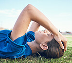 Sports, fatigue and woman with headache on a baseball field for anxiety, stress or exhaustion. Fitness, migraine and softball player on the ground with training tension, pain or mental health crisis