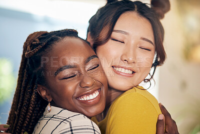 Buy stock photo Happy, smile and lesbian couple hugging with love, care and excitement together in the living room. Happiness, pride and interracial young lgbtq women bonding for affection moment in modern apartment