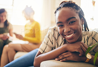 Buy stock photo Happy, smile and portrait of black woman relaxing in living room with her friends in her modern apartment. Face, positive and young African female person sitting in the lounge for rest at her home.