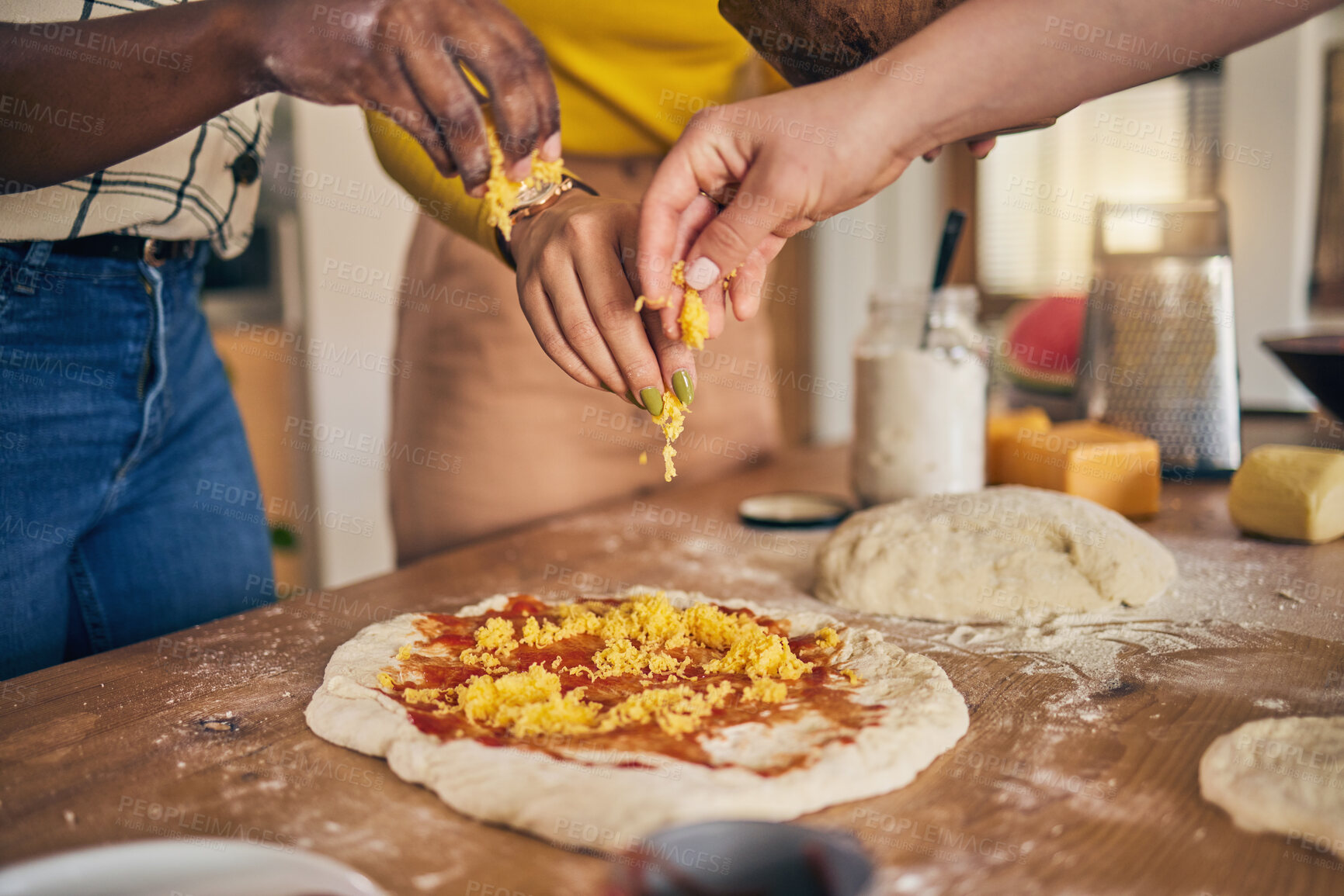 Buy stock photo Hands, cheese and pizza for cooking, together and ready for fast food, restaurant or helping with skill in Naples. Chef woman, dough and tomato sauce for cuisine, culture and preparation with process