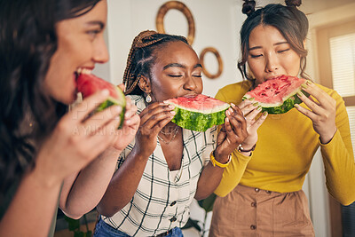 Buy stock photo Women, friends and eating watermelon in home for bonding, nutrition and happy lunch together. Healthy diet fruit, sharing and wellness, fresh summer food for friendship and girls in kitchen at party.