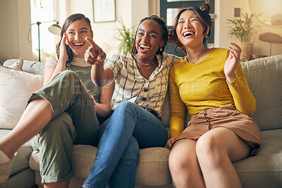 Buy stock photo Happy, friends and women watching tv on a sofa laughing, bond and relax in their home on the weekend. Television, movie and people with diversity in living room for streaming, film or comedy in house