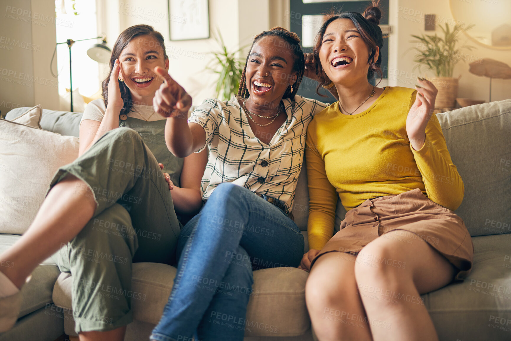 Buy stock photo Happy, friends and women watching tv on a sofa laughing, bond and relax in their home on the weekend. Television, movie and people with diversity in living room for streaming, film or comedy in house