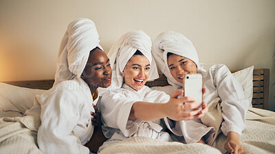 Buy stock photo Spa day, selfie and friends in bed relax with social media during skincare routine at home. Bedroom, self care and women beauty influencer with smartphone smile for profile picture, blog or podcast