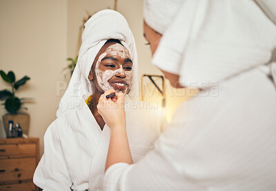 Buy stock photo Skincare, facial and women friends in a bedroom with mask, application and spa day bonding in their home. Beauty, cream and people with self care sleepover, lotion or cosmetic wellness on the weekend