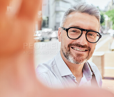 Buy stock photo Mature business man, selfie and city with smile, portrait or outdoor for travel, street and update for web blog. Entrepreneur, influencer and photography for memory, social network and happy in cbd