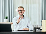 Portrait, thumbs up and smile with a business man in his office for support, motivation or success. Thank you, yes emoji and goals with a happy professional manager working in a notebook at his desk