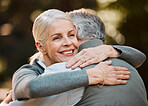 Old woman, face and senior happy couple hug, care and enjoy quality time together, bond and connect in nature park. Support, love and outdoor man, retirement wife or marriage people embrace on date