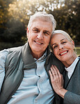 Smile, portrait and senior couple hug in a forest, love and bond in nature on a weekend trip together. Happy, face and romantic old woman embrace elderly male in woods, cheerful and enjoy retirement