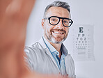 Selfie, glasses and eye exam with an optometrist man in his office for healthcare or vision improvement. Medical, portrait and eyewear with a doctor or optician in a clinic for assessment and testing