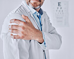 Doctor man, shoulder pain and hand with stress injury, fatigue and burnout at optometry job in clinic. Ophthalmologist, emergency or accident with muscle, bone or joint with massage in hospital