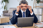 Stress, headache and businessman on a laptop in the office while working on a corporate project. Migraine, burnout and mature professional male lawyer doing research on a computer in the workplace. 