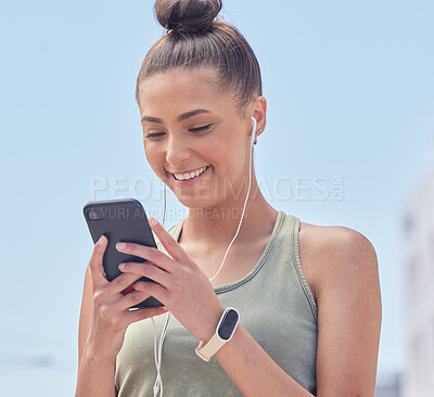 Buy stock photo Happy woman, phone and city in fitness, communication or social media smile for outdoor networking. Female person or runner texting or chatting on mobile smartphone app with earphones in urban town