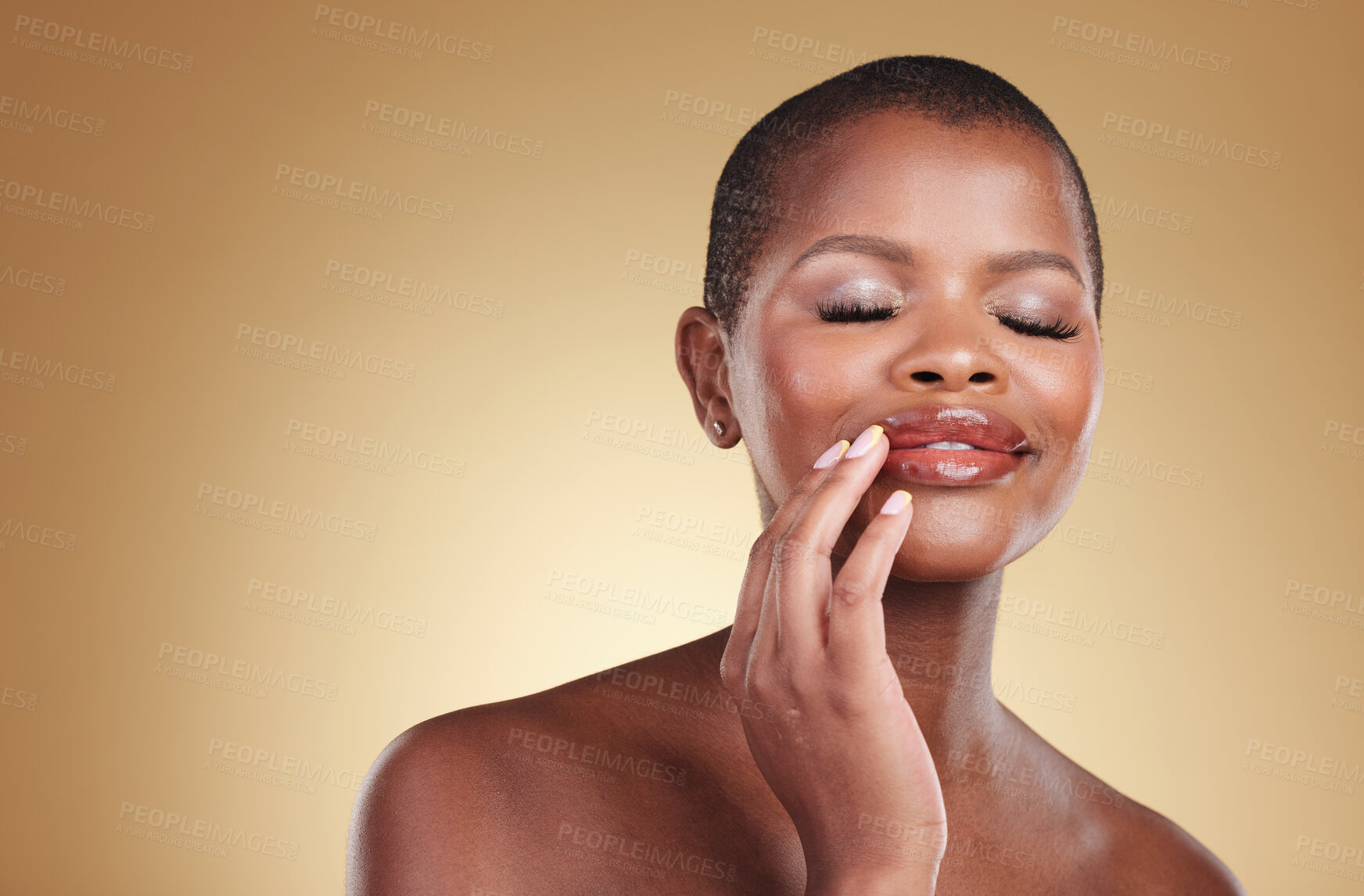 Buy stock photo Makeup, beauty and a black woman with hands on mouth in studio for skin care, glow and cosmetics. Face of african model person with shine on lips, dermatology and mockup space on beige background