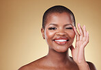 Beauty, makeup and portrait of a black woman in studio with hands on face for skin care, glow and cosmetics. African model person with facial shine, dermatology and wellness on a beige background
