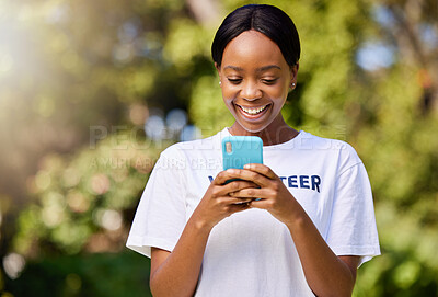 Buy stock photo Smile, park volunteering and black woman with a phone for social media, chat or communication. Happy, web and African volunteer or charity worker in nature for cleaning with a mobile for notification