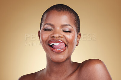 Buy stock photo Beauty, makeup and a woman lick lips in studio for skin care, glow and cosmetics. Face of a happy african person or aesthetic model with facial shine, dermatology and wellness on a beige background