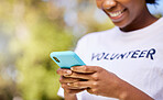 Person hands, phone and volunteering in park with social media FAQ, blog or community service website. Happy student on mobile or chat for earth day information, NGO or nonprofit contact in nature 