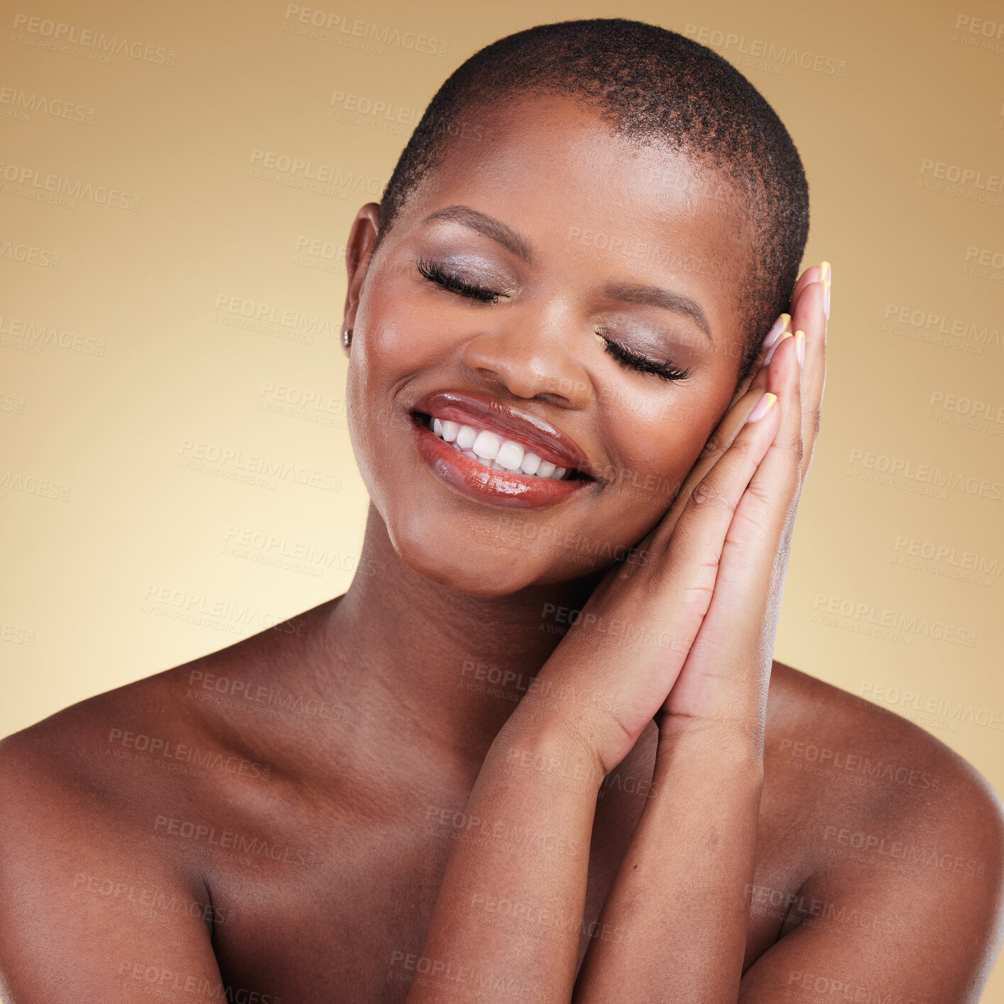 Buy stock photo Beauty, makeup and a happy woman with hands on face in studio for skin care, glow and cosmetics. Headshot of african model person with facial shine, dermatology and satisfaction on a beige background