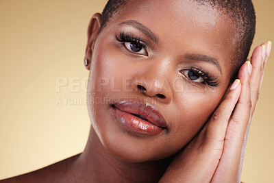 Buy stock photo Beauty, natural makeup and face of a black woman in studio with hands on skin care, glow and cosmetics. Portrait of african person or model with facial shine and wellness on a beige background