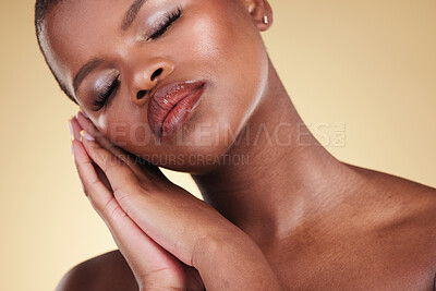 Buy stock photo Black woman, makeup and face or beauty portrait in studio for skin care, glow and cosmetics. Headshot of african person or model with facial shine, dermatology and wellness on a beige background