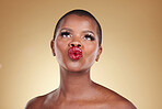 Red, lipstick and black woman, beauty and kiss, makeup and face isolated on studio background. Bold cosmetic product, lips and pout, elegant African model and glamour, headshot with color and glow