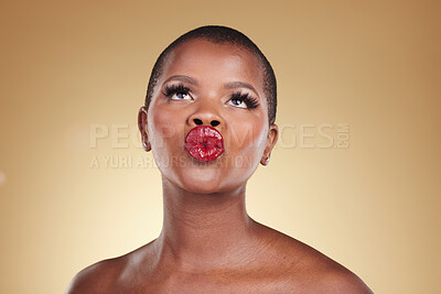 Buy stock photo Red, lipstick and black woman, beauty and kiss, makeup and face isolated on studio background. Bold cosmetic product, lips and pout, elegant African model and glamour, headshot with color and glow