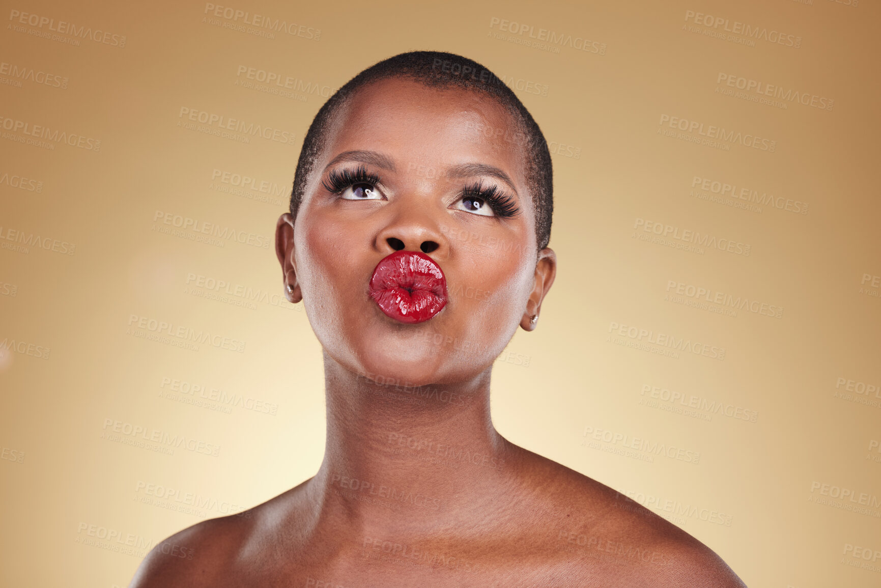 Buy stock photo Red, lipstick and black woman, beauty and kiss, makeup and face isolated on studio background. Bold cosmetic product, lips and pout, elegant African model and glamour, headshot with color and glow